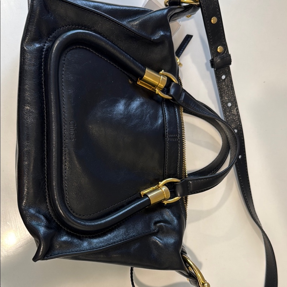 Elegant Black Leather Shoulder Bag with Gold Details